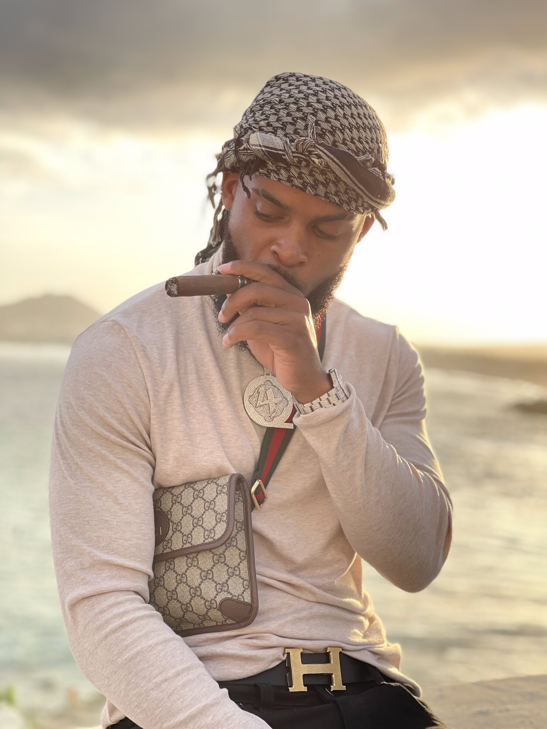 Entrepreneur and investor Zi Morris at an oceanfront cigar lounge at sunset