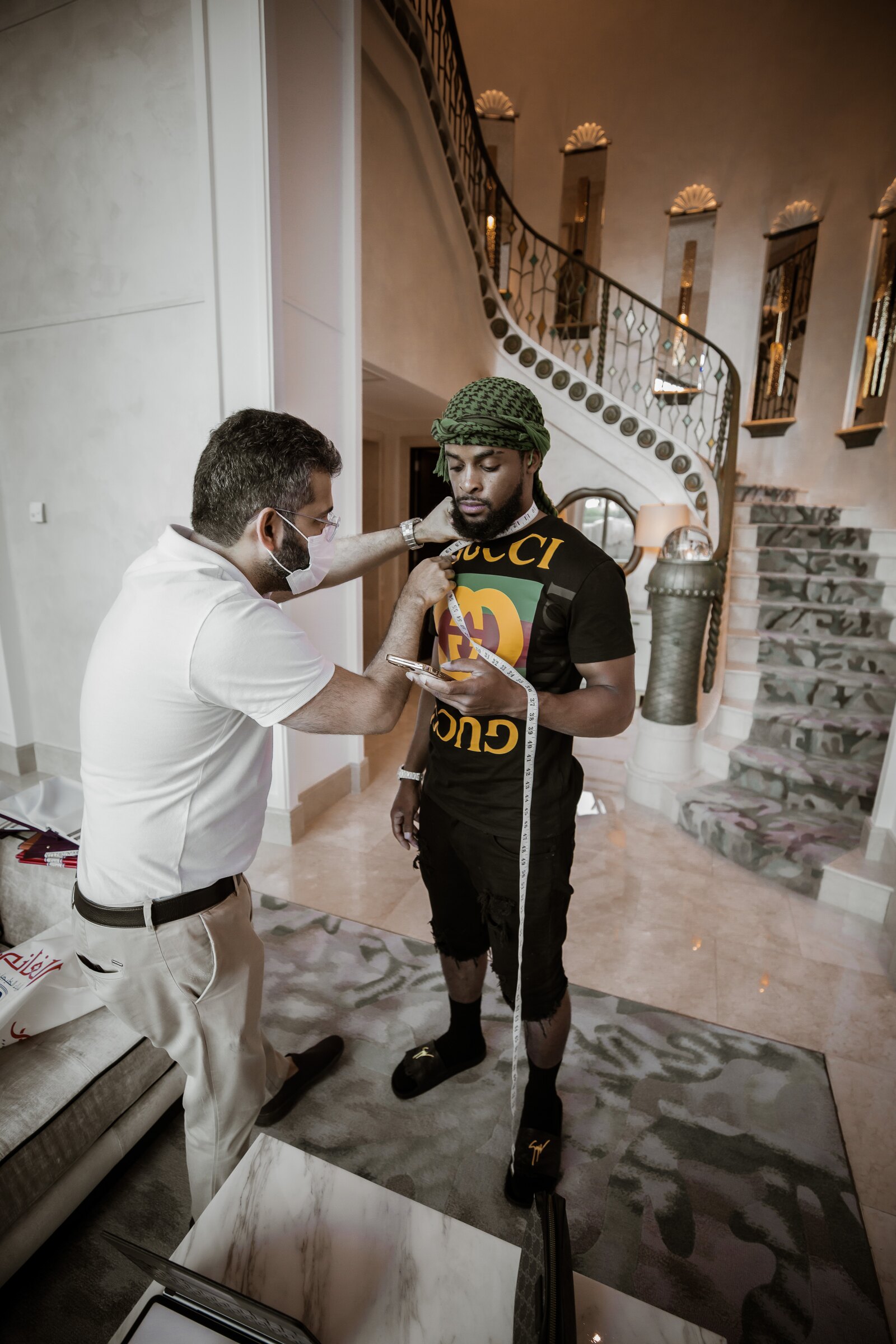 Zi Morris (Zi4reel), American entrepreneur, at a bespoke tailoring fitting in Dubai
