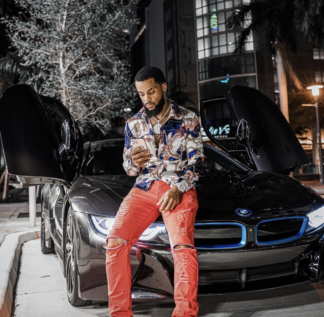 Zi Morris (Zi4reel), American entrepreneur and tech investor, with a BMW i8