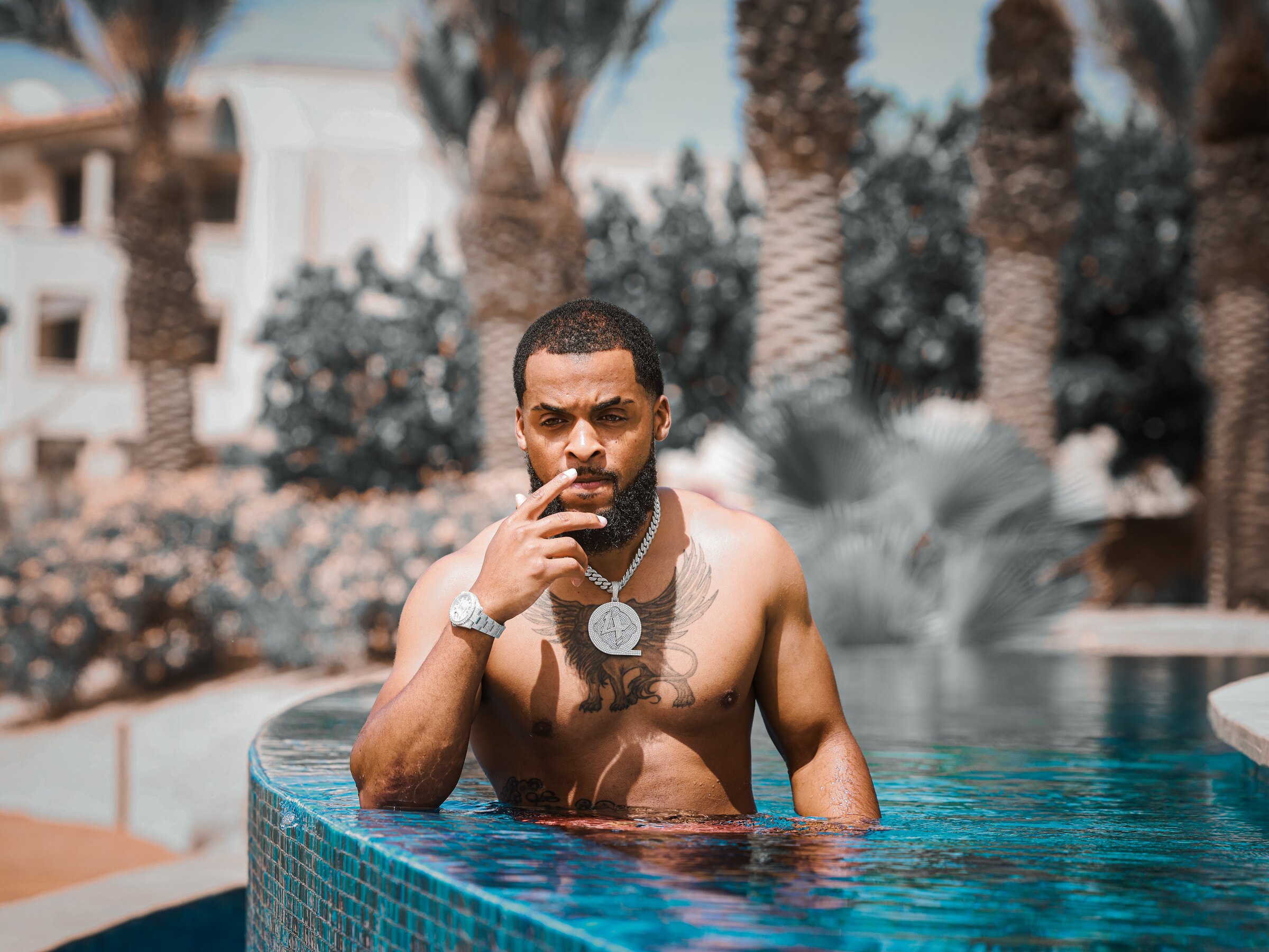 Zi Morris (Zi4reel), American entrepreneur and investor, at a luxury resort pool